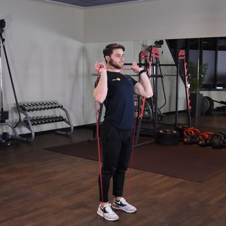 Wyciskanie gumy power band nad głowę w staniu