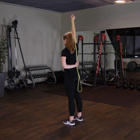Prostowanie ramienia z gumą power band nad głową just be fit